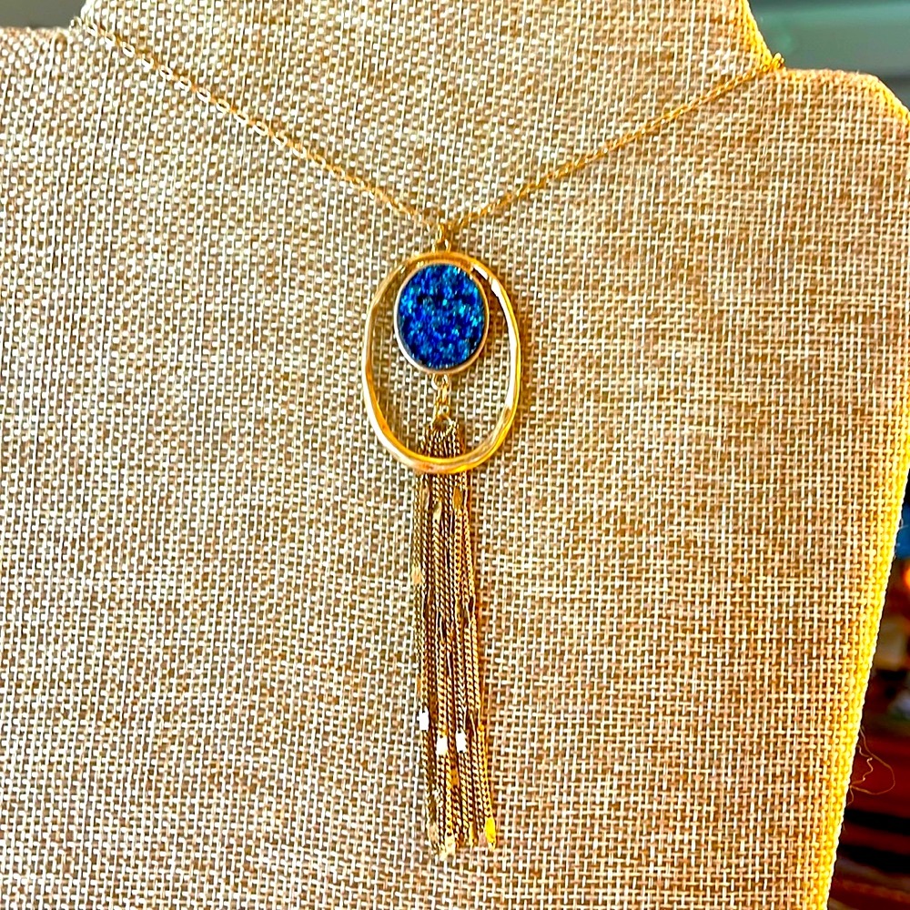 Long druzy with tassels blue set in gold tone frame on chain that’s adjustable